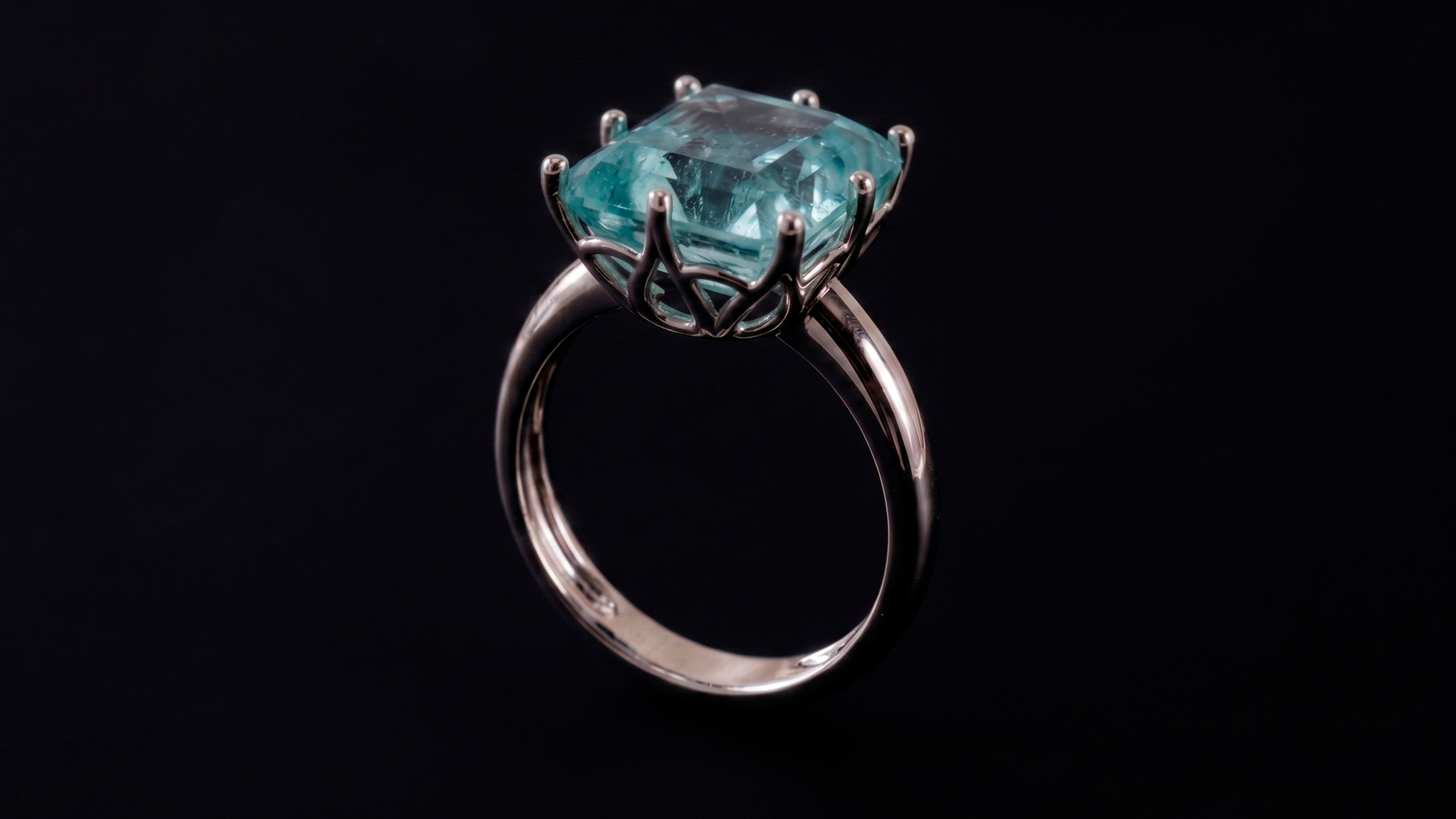 Module 02 — white gold organic-claw solitaire with aquamarine and branched claws, ZBrush render
